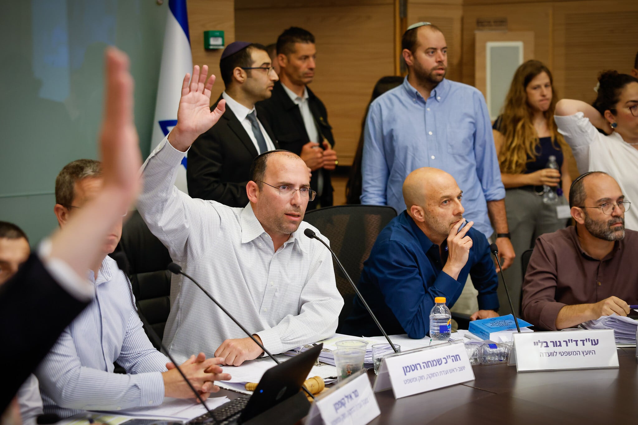 MKs vote to advance bills splitting and weakening role of AG, making it harder to indict PM
