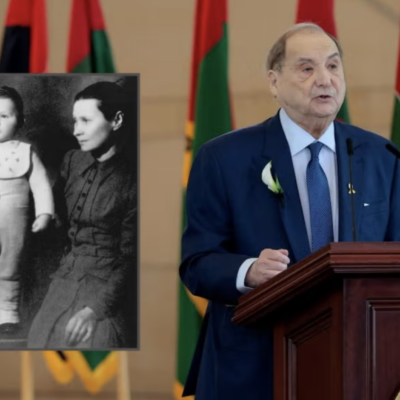 Abe Foxman speaks at the United States Holocaust Memorial Museum's Annual Days of Remembrance ceremony at the US Capitol in Washington on April 23, 2025. Beside him is a portrait from the Heschel School of Foxman as a young boy with the nanny who hid him during the Holocaust. (Getty Images, via JTA)