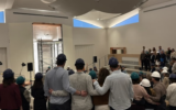 Kehillat Israel congregants gather in the remodeled sanctuary, while it is still under construction, ahead of the ceremony on May 15, 2026. (Courtesy of Kehillat Israel)