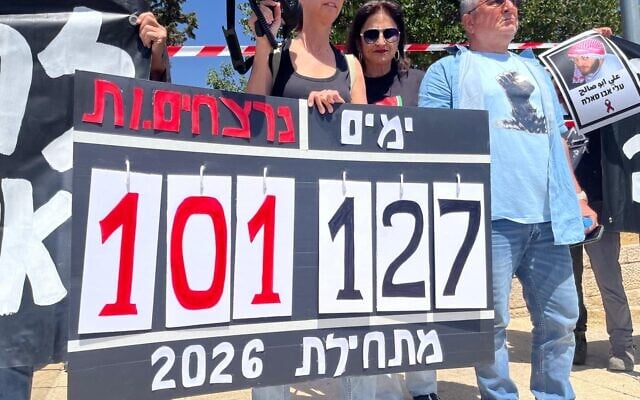 Protesters hold a sign reading '127 days, 101 victims since the beginning of 2026,' as they demonstrate against what they say is police inaction in the face of raging violence across Arab communities in Israel, outside the Israel Police headquarters in Jerusalem, on May 8, 2026. (Orna Kupferman/Pro-Democracy Protest Movement)