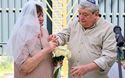 A Jewish couple is wed in a mass wedding ceremony in Kyiv, May 2026. (Courtesy of JCC Kiev)