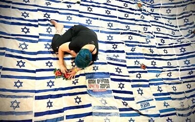 Artist Tal Tenne Czaczkes working on her Flag of Flags, a massive canopy made of abandoned Israeli flags now being shown around the country, in May 2026 (Roni Czaczkes) Artist Tal Tenne Czaczkes working on her Flag of Flags, a massive canopy made of abandoned Israeli flags now being shown around the country, in May 2026 (Roni Czaczkes)