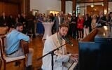 Alon Ohel, far right, and his brother, Ronen Ohel, perform at the Israeli ambassador's residence in Berlin on May 18, 2026 (WJC / Nicolai Froundjian)