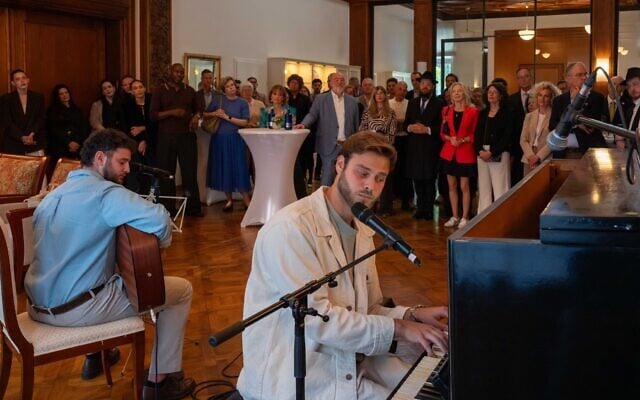 Alon Ohel, far right, and his brother, Ronen Ohel, perform at the Israeli ambassador's residence in Berlin on May 18, 2026 (WJC / Nicolai Froundjian) Alon Ohel, far right, and his brother, Ronen Ohel, perform at the Israeli ambassador's residence in Berlin on May 18, 2026 (WJC / Nicolai Froundjian)