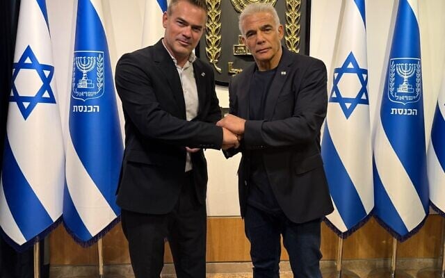 Yesh Atid MK Boaz Toporovsky (left) and party leader Yair Lapid, in an undated image released by the party on May 27, 2026. (Yesh Atid)