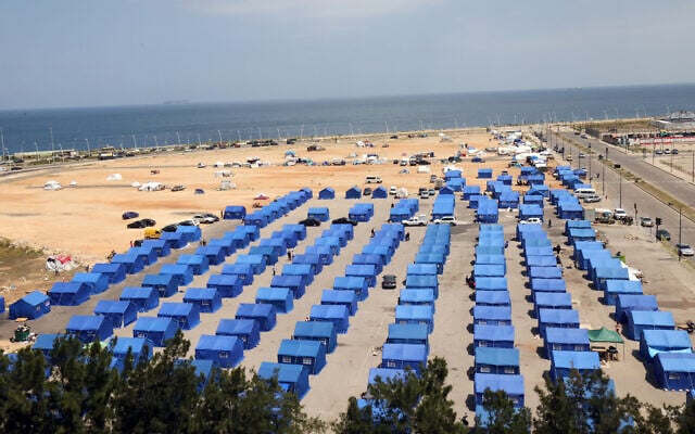 This picture show a view of blue tents set up by the Lebanese government for people who fled their homes and villages in Beirut's southern suburbs and southern Lebanon, on May 22, 2026. (Anwar AMRO/AFP)