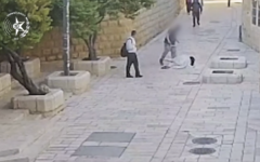 A man kicks a nun in the Old City of Jerusalem on April 28, 2026. (Screenshot/Israel Police)