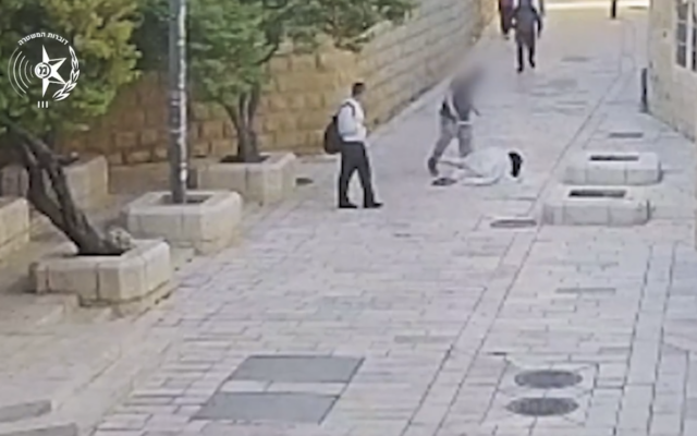 A man kicks a nun in the Old City of Jerusalem on April 28, 2026. (Screenshot/Israel Police)