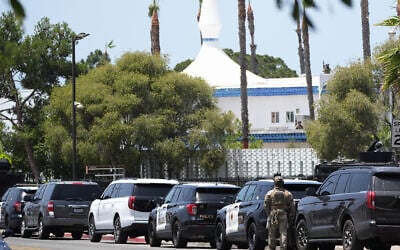 Police stage at the scene of a shooting outside the Islamic Center of San Diego, May 18, 2026, in San Diego. (Gregory Bull/AP)