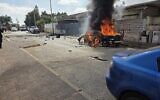 Fire pours out of a car that exploded, killing one, in Afula, northern Israel, on May 26, 2026. (Magen David Adom)