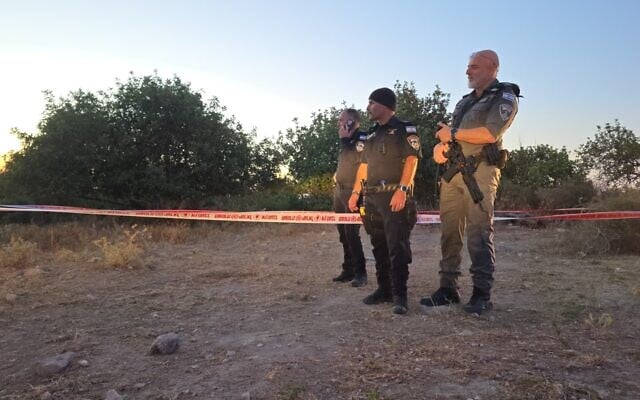 Police at the scene where a man and woman were found shot and killed in their car near Mishmar Ayalon, May 22, 2026. (Israel Police)