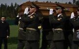 Ukraine's President Volodymyr Zelensky (L) attends the reburial ceremony of Ukrainian nationalist leader Andriy Melnyk, who collaborated with the Nazis, at the National Military Memorial Cemetery near Kyiv on May 25, 2026. (Genya SAVILOV / AFP via JTA)