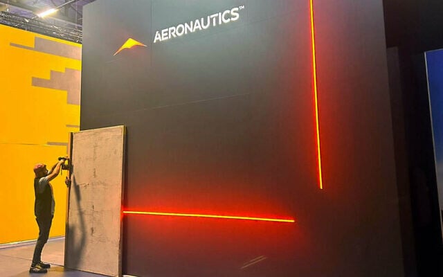 Worker erects wooden panels around Israeli defense industry booths at the Eurosatory exhibition in Paris, June 15, 2026. (Defense Ministry) Worker erects wooden panels around Israeli defense industry booths at the Eurosatory exhibition in Paris, June 15, 2026. (Defense Ministry)