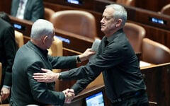 Israeli Prime Minister Benjamin Netanyahu with Israeli minister Benny Gantz at a special plenum session presenting the new emergency government at the assembly hall of the Knesset, October 12, 2023 (Noam Revkin Fenton/Flash90)