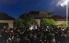 Ultra-Orthodox men protest against the jailing of yeshiva students who failed to comply with an army recruitment order, at the home of Supreme Court Justice Noam Sohlberg in the settlement of Alon Shvut, June 3, 2026. (Chaim Goldberg/Flash90)