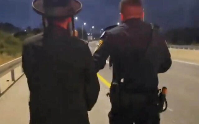 A Haredi protester being arrested in Beit Shemesh during protests at the police station on May 31, 2026. (Screentshot/X/ Yishai Cohen/Israel Police) A Haredi protester being arrested in Beit Shemesh during protests at the police station on May 31, 2026. (Screentshot/X/ Yishai Cohen/Israel Police)