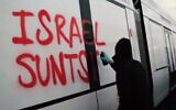 A pro-Palestinian, anti-Israel activist sprays the phrase "destroy Israel" in the Basque language on the side of a light rail carriage manufactured by CAF for the Tel Aviv light rail's Purple Line, in Beasain, Spain, in a video from June 4, 2026. (Screenshot/X, used in accordance with Clause 27a of the Copyright Law)