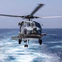 An MH-60R Sea Hawk Helicopter prepares to land on the flight deck of Arleigh Burke-class guided-missile destroyer USS Truxtun (DDG 103) during a replenishment-at-sea with the Henry J. Kaiser-class replenishment oiler USNS Henry J Kaiser (T-AO-187), June 5, 2026.  (US Navy photo)