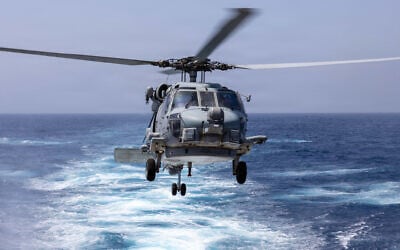 An MH-60R Sea Hawk Helicopter prepares to land on the flight deck of Arleigh Burke-class guided-missile destroyer USS Truxtun (DDG 103) during a replenishment-at-sea with the Henry J. Kaiser-class replenishment oiler USNS Henry J Kaiser (T-AO-187), June 5, 2026.  (US Navy photo)