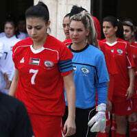 Illustrative: Palestinian female football players are seen during a qualifying match against Thailand for the Asian Women football Cup in the West Bank town of al-Ram on April 3, 2017.(Photo by ABBAS MOMANI / AFP)