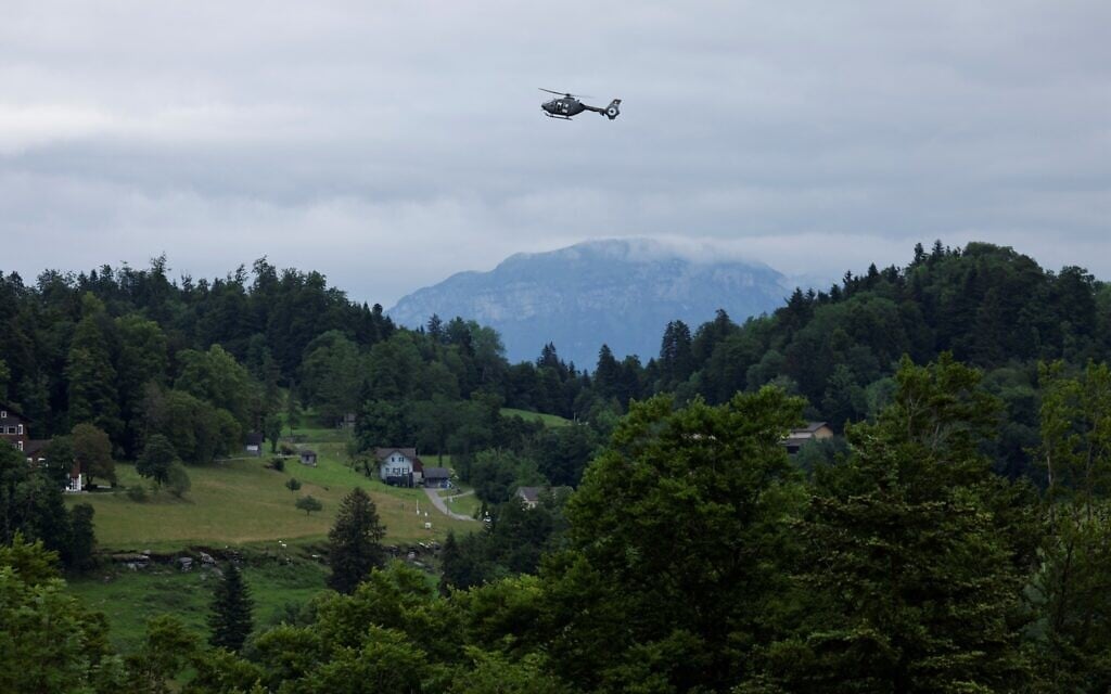A military helicopter hovers as leaders arrive to take part in a Summit on Peace in Ukraine at the luxury Buergenstock resort, near Lucerne in central Switzerland, on June 15, 2024. (Ludovic MARIN / AFP)