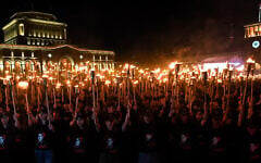 Armenians take part in the annual torch march on the eve of the Genocide Remembrance Day in Yerevan, on April 23, 2025. (KAREN MINASYAN / AFP)