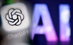 The letters AI, for artificial intelligence on a laptop screen, at right, next to the logo of the ChatGPT application on a smartphone screen, in Frankfurt am Main, Germany, September 1, 2025. (Kirill Kudryavtsev/AFP)