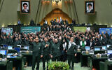 Iranian parliament members wear Islamic Revolutionary Guard Corps uniforms and chant 'Death to America' during a session in Tehran on February 1, 2026. (ICANA NEWS AGENCY / AFP)