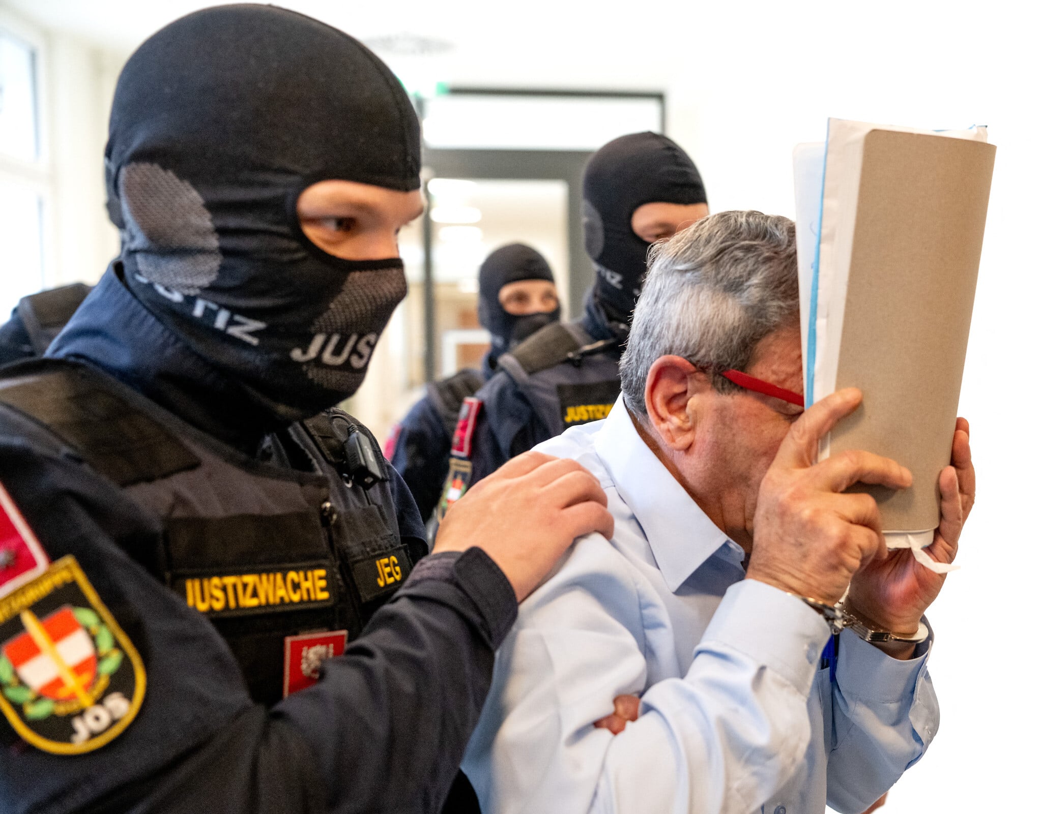 Two Syrian former officials deny civil war torture charges as trial opens in Austria