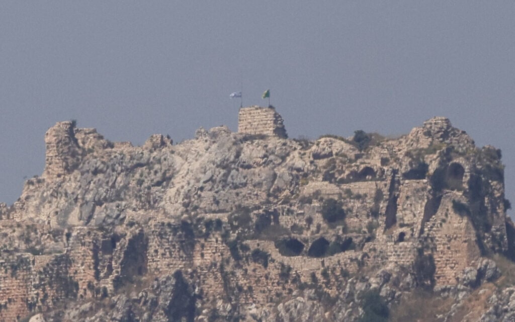 This picture taken from Marjayoun, southern Lebanon, shows an Israeli flag and a Golani Brigade flag fluttering atop the medieval Beaufort Castle in Arnoun on June 1, 2026 (AFP)