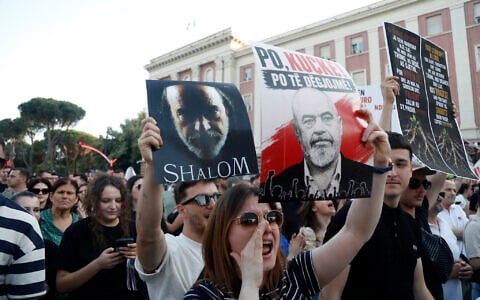Albanian protestors take part in a demonstration in front of the prime minister's office, against the construction of a luxury resort near a protected natural area, in Tirana on June 2, 2026. (AFP)