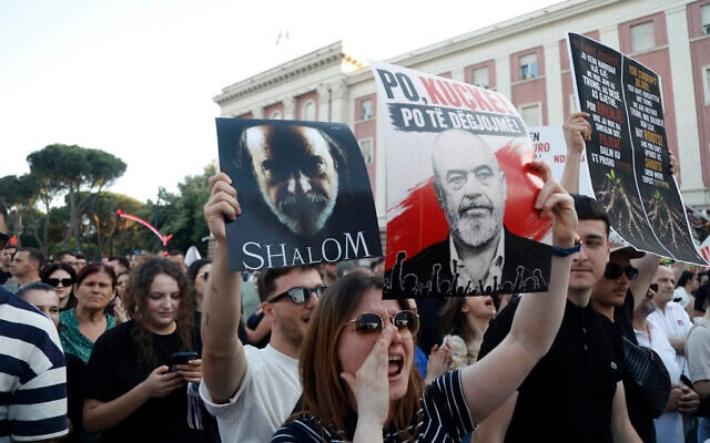 Albanian protestors take part in a demonstration in front of the prime minister's office, against the construction of a luxury resort near a protected natural area, in Tirana on June 2, 2026. (AFP)