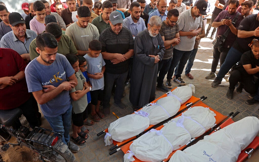 Palestinians pray over the bodies of people killed in Israeli airstrikes in Gaza City on June 4, 2026. (Omar AL-QATTAA / AFP)