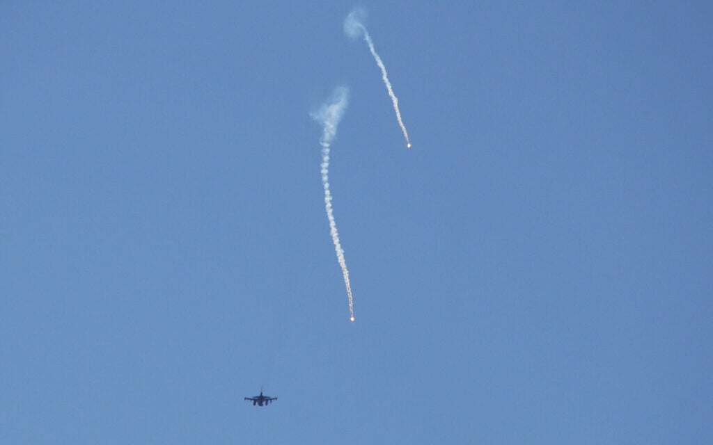 An Israeli warplane releases flares while flying over the southern Lebanese area of Marjayoun on June 4, 2026. (AFP)