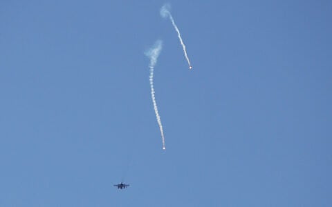 An Israeli warplane releases flares while flying over the southern Lebanese area of Marjayoun on June 4, 2026. (AFP)