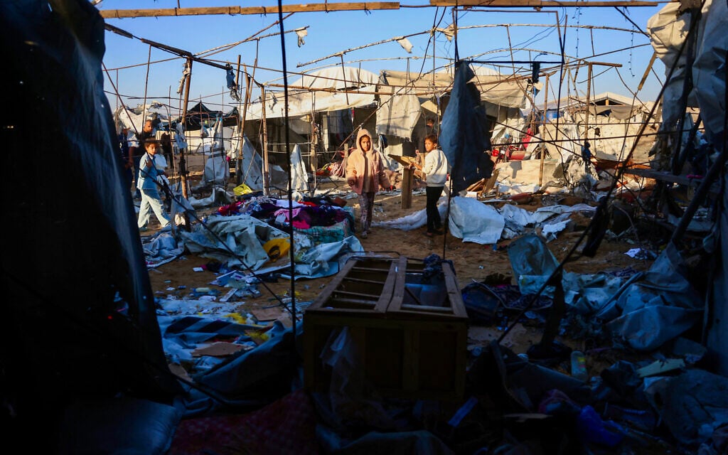 Palestinian children look for salvageable items in the destroyed tents following an Israeli strike in Khan Younis in the southern Gaza Strip on June 5, 2026. (Bashar Taleb/AFP)