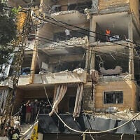 First responders inspect damage at the site of an Israeli airstrike on an apartment building on the Dahiyeh suburb of Beirut, Lebanon, June 7, 2026. (AFP)