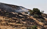 Smoke rises after Israeli settlers allegedly set fire to agricultural fields surrounding the village of Taybeh, in the West Bank on June 10, 2026. (Zain JAAFAR / AFP)