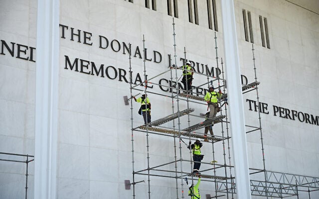 Workers stand on scaffolding near the signage for the Donald J. Trump and John F. Kennedy Memorial Center for the Performing Arts in Washington, DC, on June 12, 2026. (Alex WROBLEWSKI / AFP) Workers stand on scaffolding near the signage for the Donald J. Trump and John F. Kennedy Memorial Center for the Performing Arts in Washington, DC, on June 12, 2026. (Alex WROBLEWSKI / AFP)