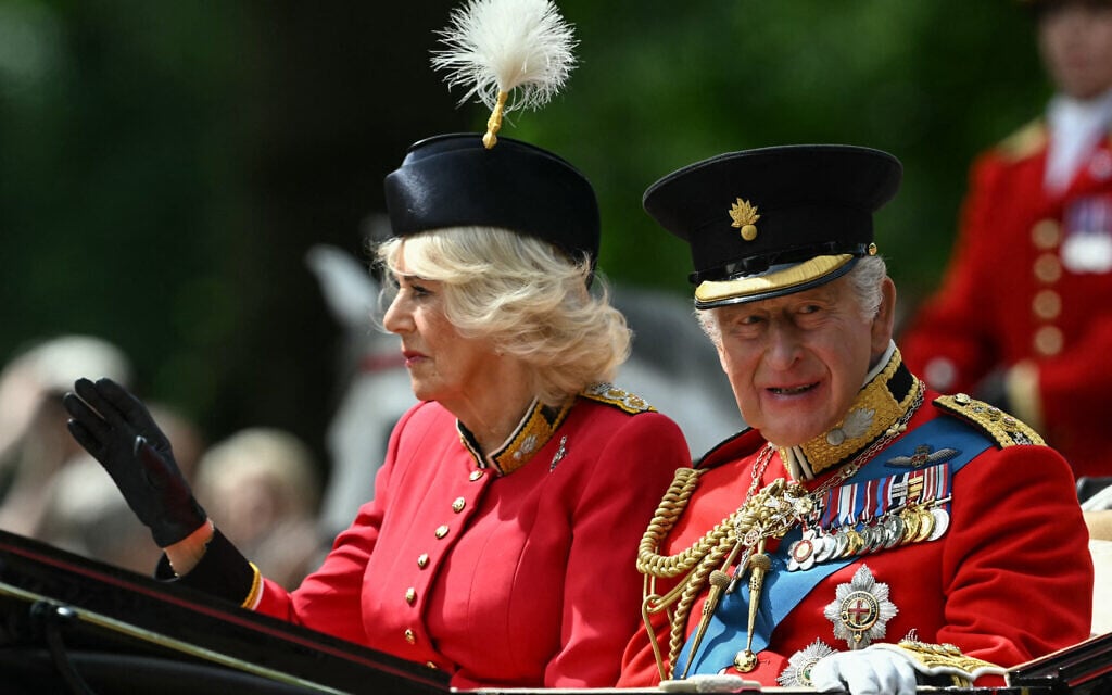 Britain's King Charles III and Britain's Queen Camilla arrive to attend the King's Birthday Parade "Trooping the Colour" in London on June 13, 2026. (Photo by JUSTIN TALLIS / AFP)
