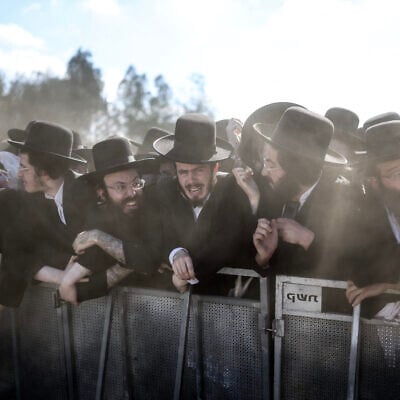 Security forces stand guard as ultra-Orthodox Jews gather to protest against the detention of Haredi draft evaders outside the Bet Lid military prison in Kfar Yona on June 17, 2026. (Ilia Yefimovich/AFP) Security forces stand guard as ultra-Orthodox Jews gather to protest against the detention of Haredi draft evaders outside the Bet Lid military prison in Kfar Yona on June 17, 2026. (Ilia Yefimovich/AFP)