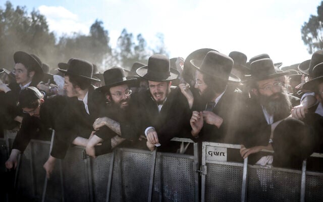 Security forces stand guard as ultra-Orthodox Jews gather to protest against the detention of Haredi draft evaders outside the Bet Lid military prison in Kfar Yona on June 17, 2026. (Ilia Yefimovich/AFP) Security forces stand guard as ultra-Orthodox Jews gather to protest against the detention of Haredi draft evaders outside the Bet Lid military prison in Kfar Yona on June 17, 2026. (Ilia Yefimovich/AFP)