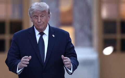 US President Donald Trump gestures as he arrives at Chateau de Versailles ahead of a dinner to celebrate the 250th anniversary of the independence of the United States, in Versailles southwest of Paris on June 17, 2026. (Photo by Guillaume BAPTISTE / AFP)
