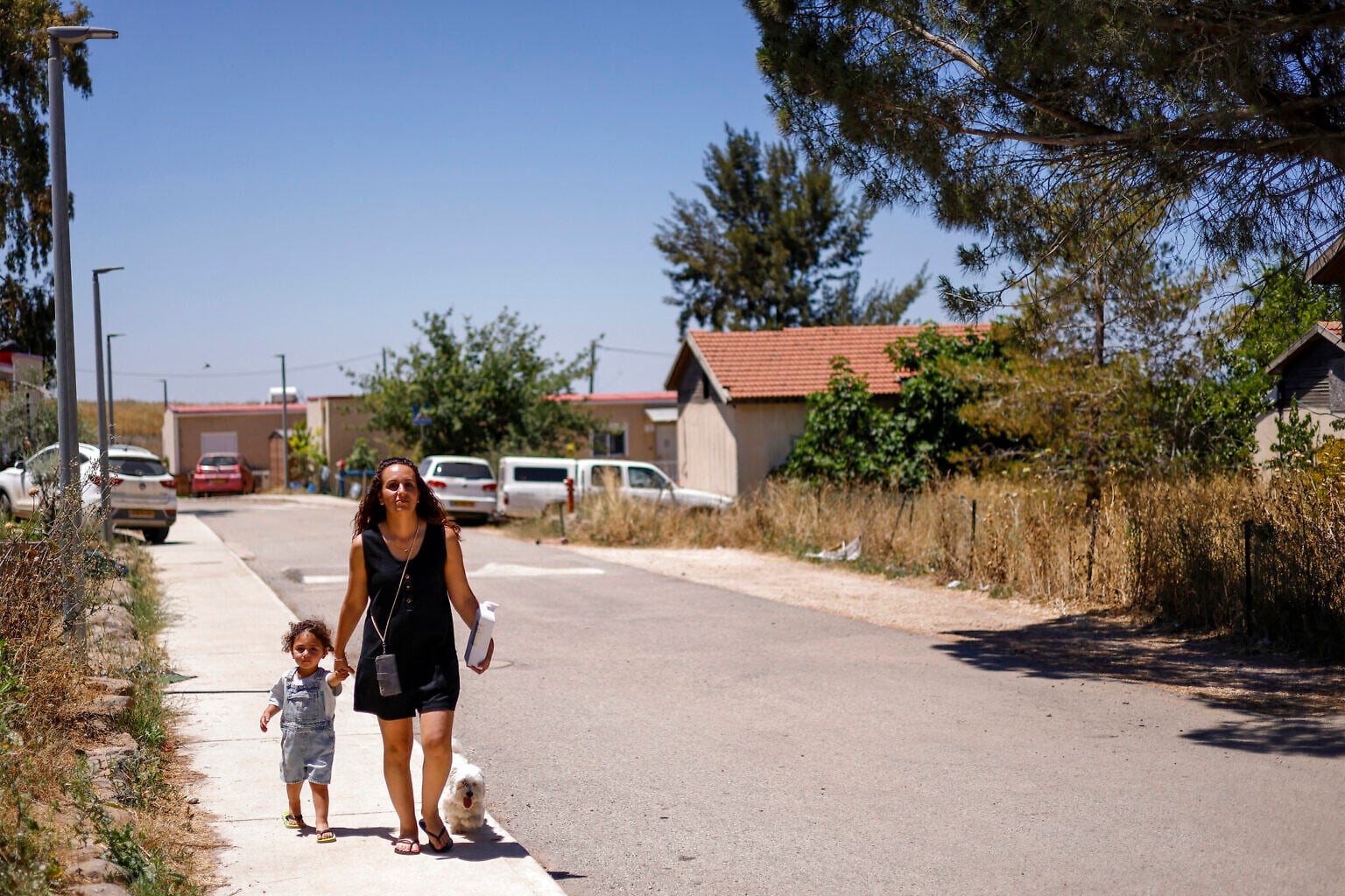 A woman and child walk in Ramat Trump (Trump Heights) in the Golan Heights on June 19, 2026 (Jalaa MAREY / AFP)