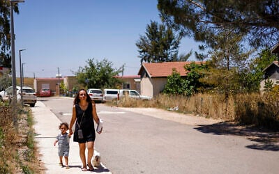 A woman and child walk in Ramat Trump (Trump Heights) in the Golan Heights on June 19, 2026 (Jalaa MAREY / AFP)