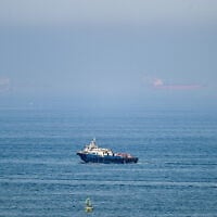 Cargo ships are pictured off the coast of the Khor Fakkan Container Terminal, the only natural deep-sea port in the region and one of the major container ports in Sharjah Emirate, along the Gulf of Oman on June 19, 2026 (AFP)