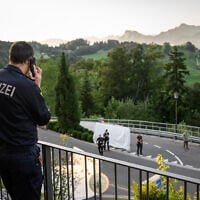 Police officers secure the Burgenstock luxury hotel complex overlooking Lake Lucerne, Switzerland, on June 21, 2026, ahead of high-level talks aimed at advancing a deal to end the Middle East conflict. (Fabrice COFFRINI / AFP)