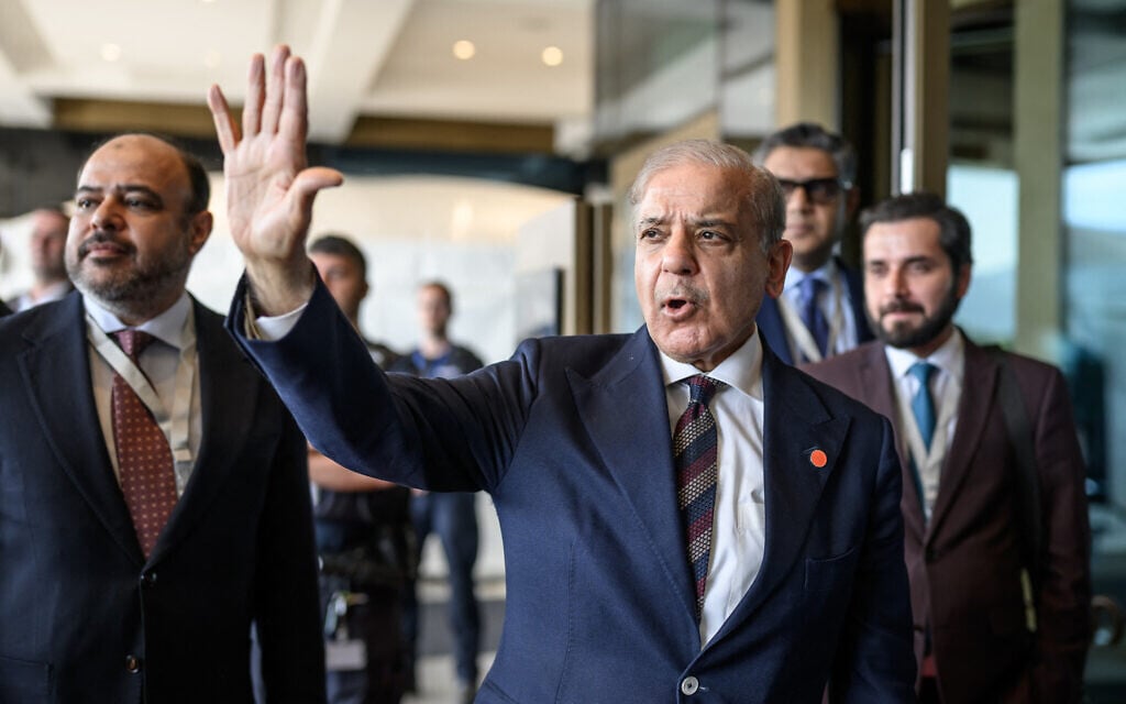Pakistan's Prime Minister Muhammad Shehbaz Sharif gestures upon his arrival at the Burgenstock luxury hotel complex overlooking Lake Lucerne, Switzerland, on June 21, 2026, ahead of high-level talks aimed at advancing a deal to end the Middle East conflict (Fabrice Coffrini / POOL / AFP)