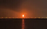 This frame grab from AFPTV video footage on June 21, 2026, shows an explosion at Qatar's Ras Laffan industrial zone, home to the world's largest liquefied natural gas hub, as the result of a "technical incident". (AFPTV / AFP)