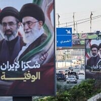 Cars and motorbikes drive past billboards showing Iran's Supreme Leader Ayatollah Mojtaba Khamenei (L) and his late father Ali Khamenei (R), with the slogan 'Thank you, loyal Iran,' in Beirut on June 22, 2026. (Anwar AMRO / AFP)